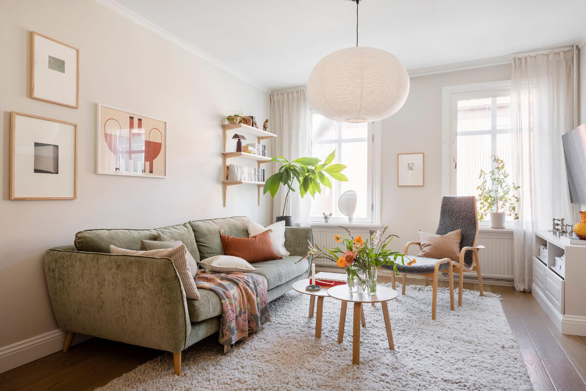 Bright Rooms with Light Color Tones in a Swedish Apartment 2 living room green sofa