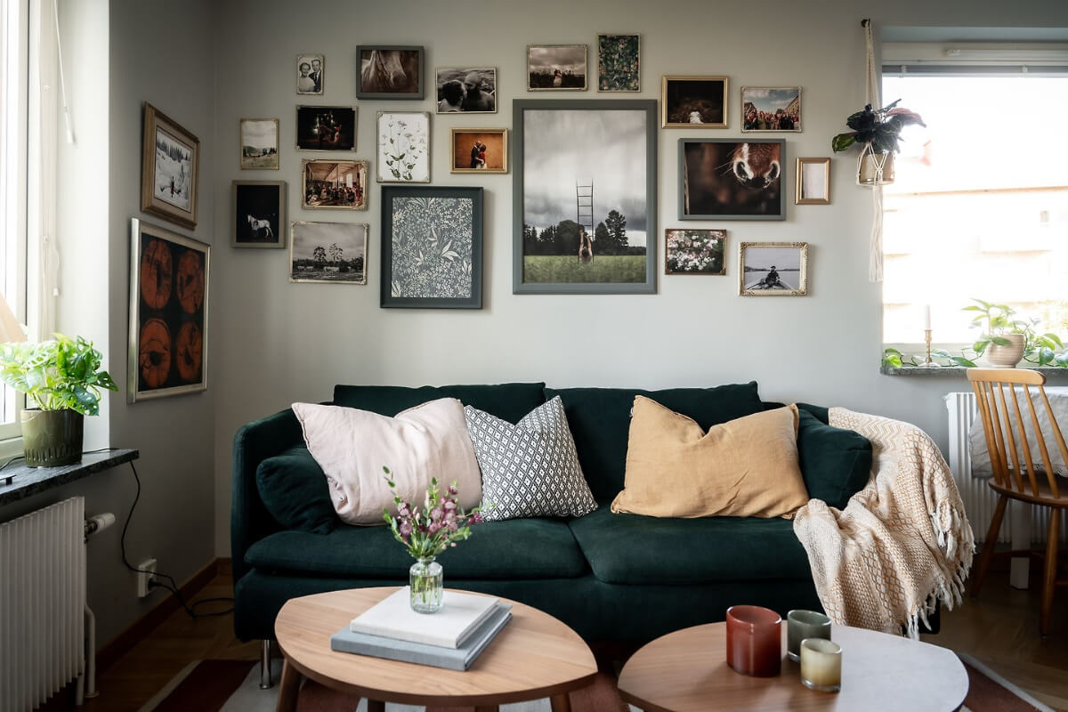 A Charming Apartment with Large Windows and Colorful Bedrooms 4 living room green velvet sofa