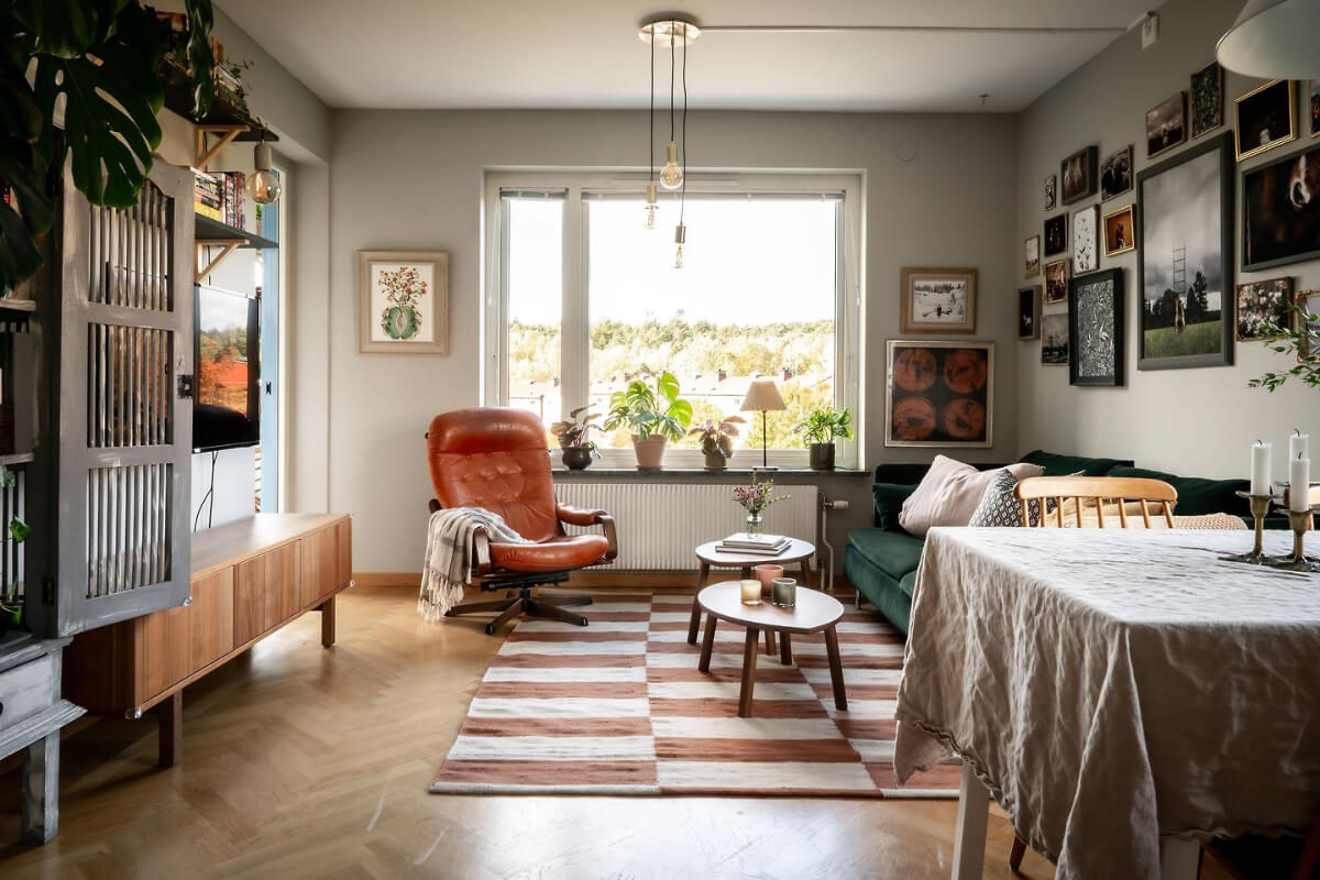 A Charming Apartment with Large Windows and Colorful Bedrooms 5 living room herringbone floor