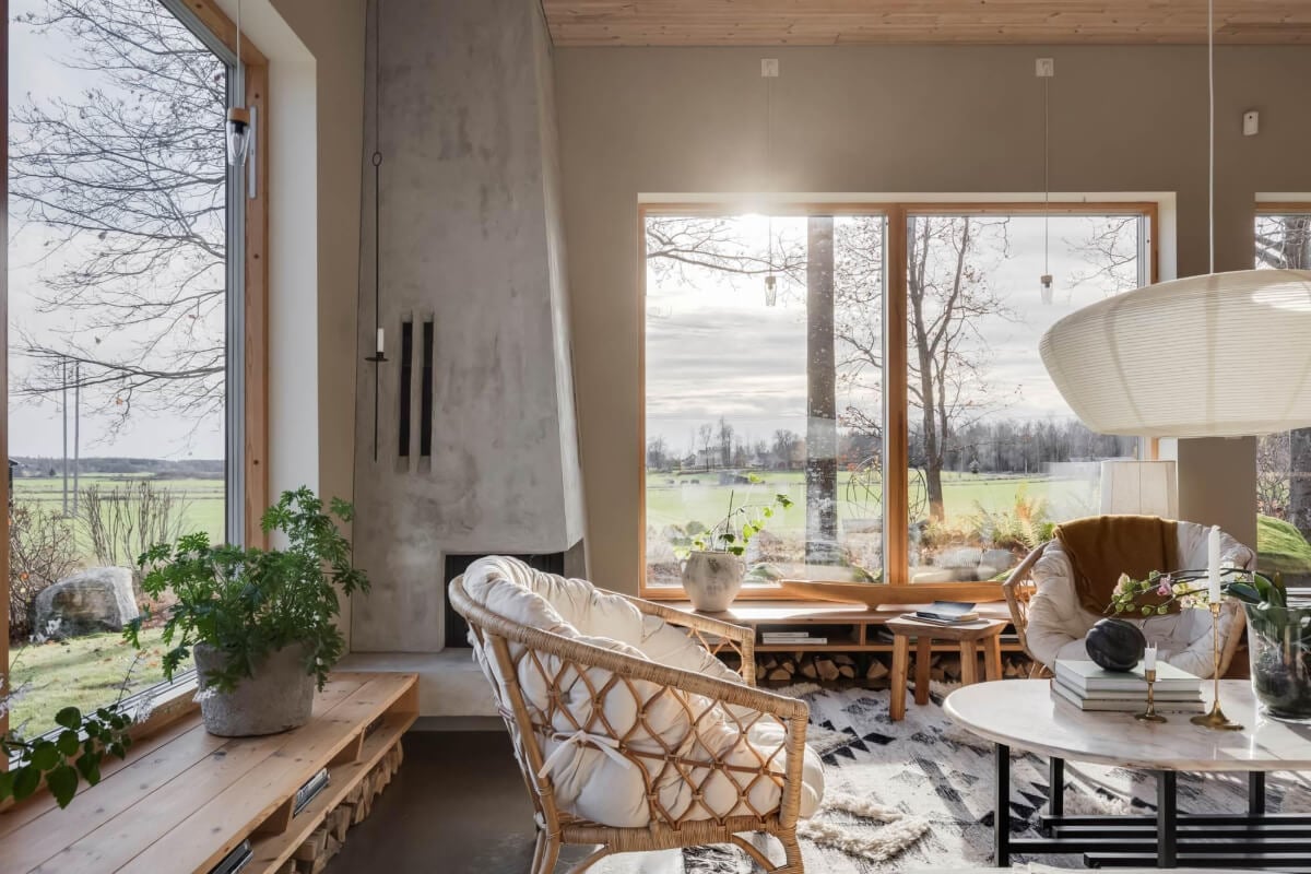 A Swedish Architectural Villa Surrounded by Nature 3 living room large windows natural materials