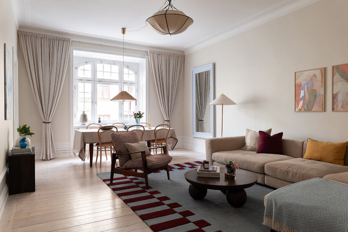 Contrasting Colors in a Turn-of-the-Century Apartment in Stockholm 1 living room pastel blue mirror Contrasting Colors in a Turn-of-the-Century Apartment in Stockholm