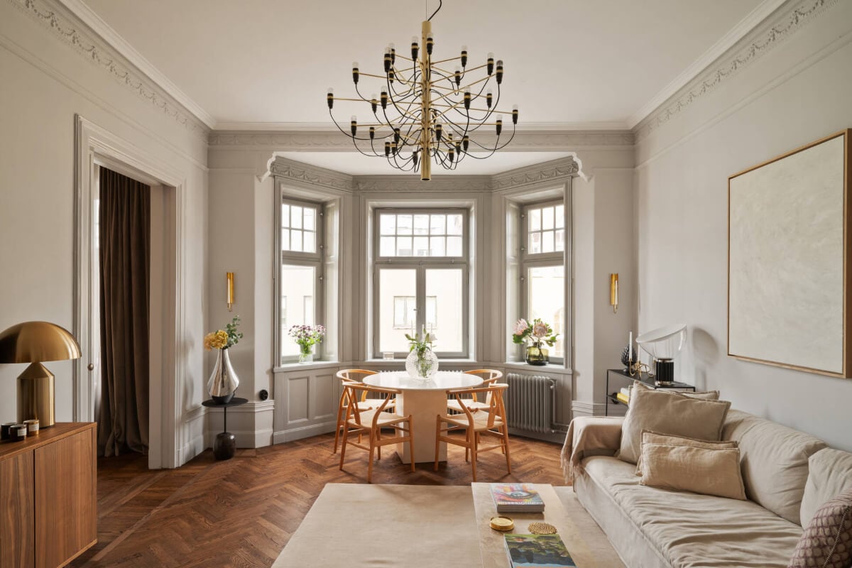 Beautiful Period Features in a One-Bedroom Stockholm Apartment 1 living room period features herringbone parquet floor bay window