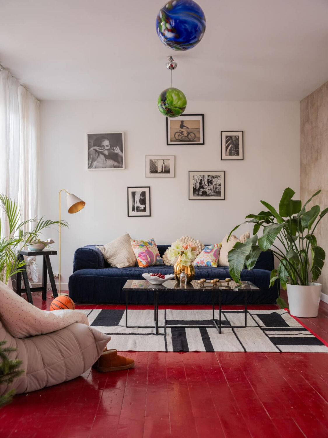 A Colored Sixth Wall May Be The Biggest Paint Trend in 2026 18 living room red wooden floor blue couch