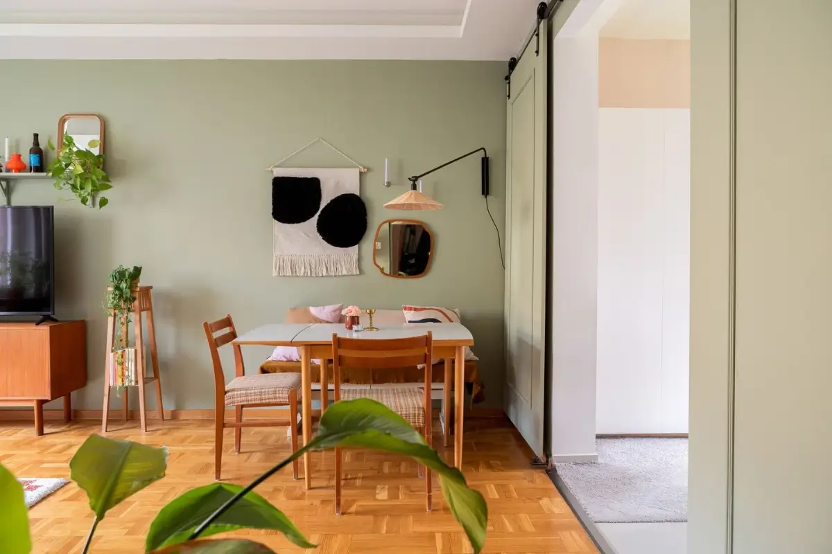 A Swedish Apartment with a Dutch Parquet Floor and Terracotta Bedroom 6 living room sage green walls dutch parquet floor midcentury furniture