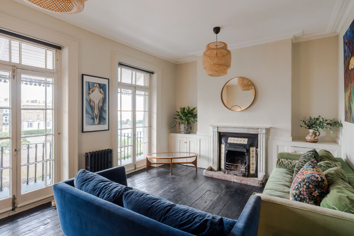 Timeworn Original Floorboards in a Regency Seaside Home 13 living room tall windows black floor