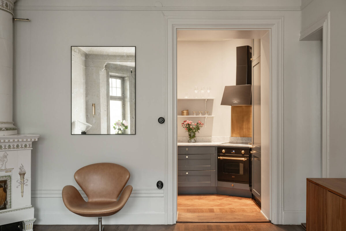 Beautiful Period Features in a One-Bedroom Stockholm Apartment 5 living room view into kitchen