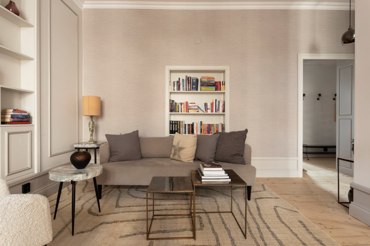 A Stylish Two-Bedroom Apartment in Stockholm 2 living room wallpaper former doorway turned into bookshelves