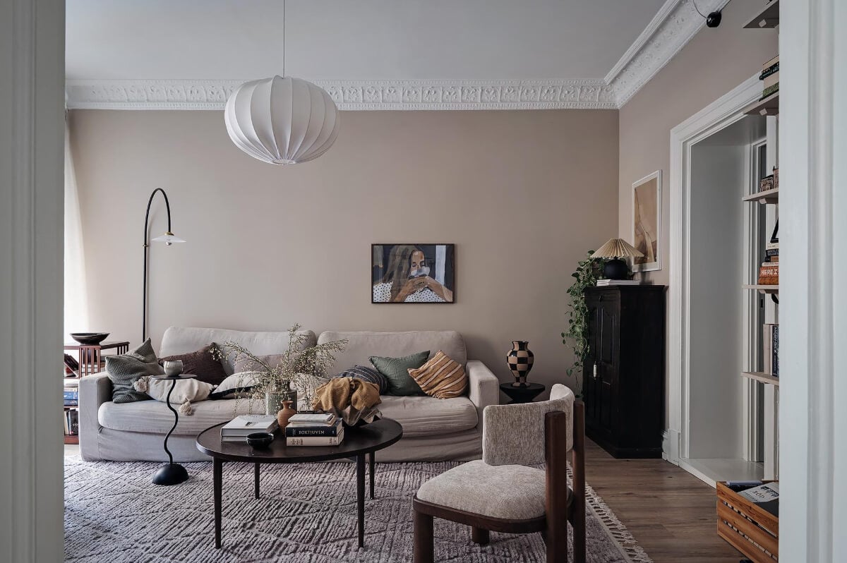Warm and Inviting Rooms in a Renovated Swedish Apartment 8 living room warm beige walls stucco