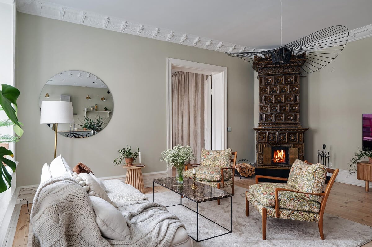 A Swedish Apartment with an Open Living Space and Period Features 4 living room william morris patterned armchairs