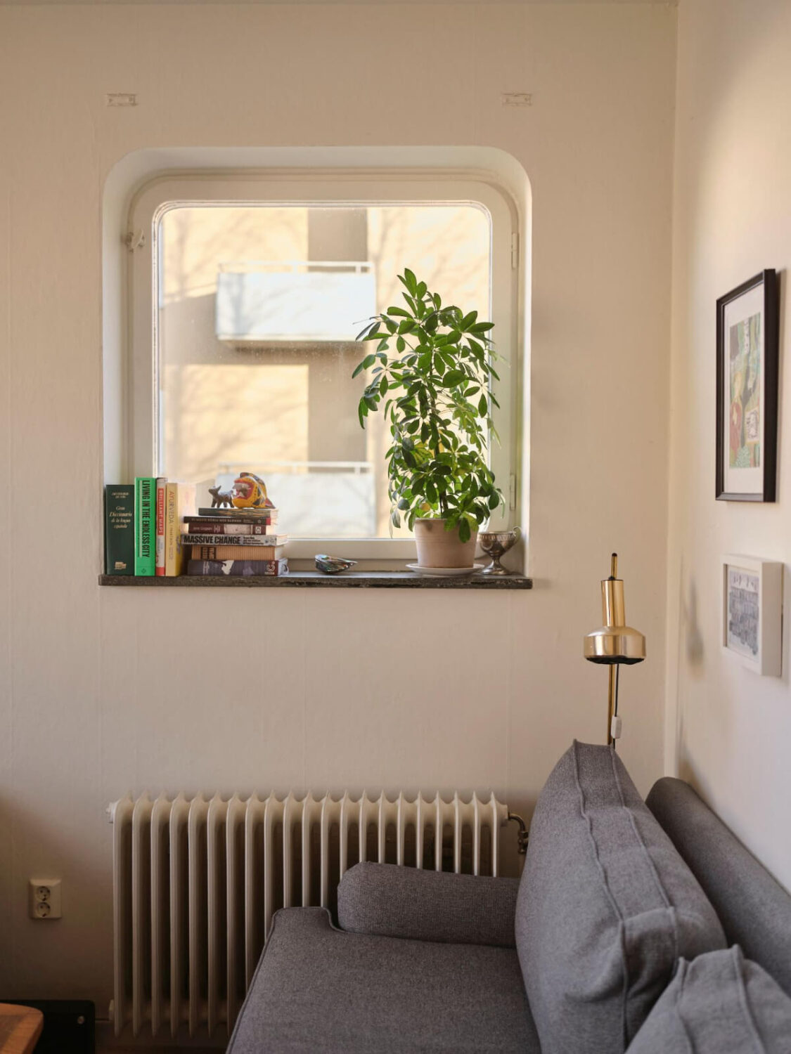 A Small, Light Swedish Apartment with Midcentury Features 3 living room window