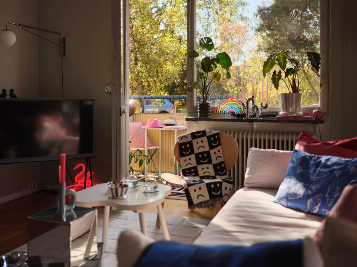 A Midcentury Swedish Apartment with Bright Color Accents 4 living room with balcony