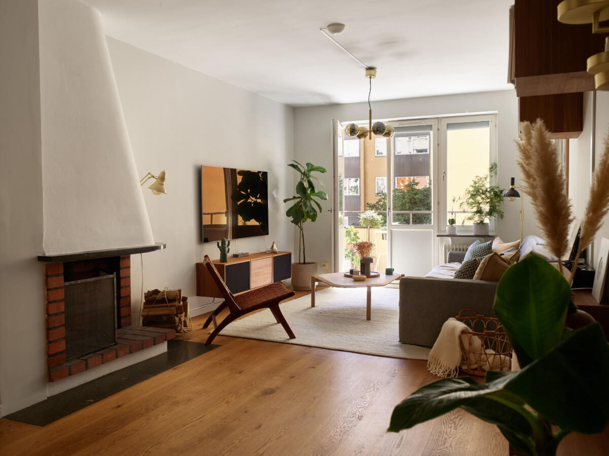 A Stockholm Apartment with a Beautifully Renovated Kitchen 1 living room with brick fireplace