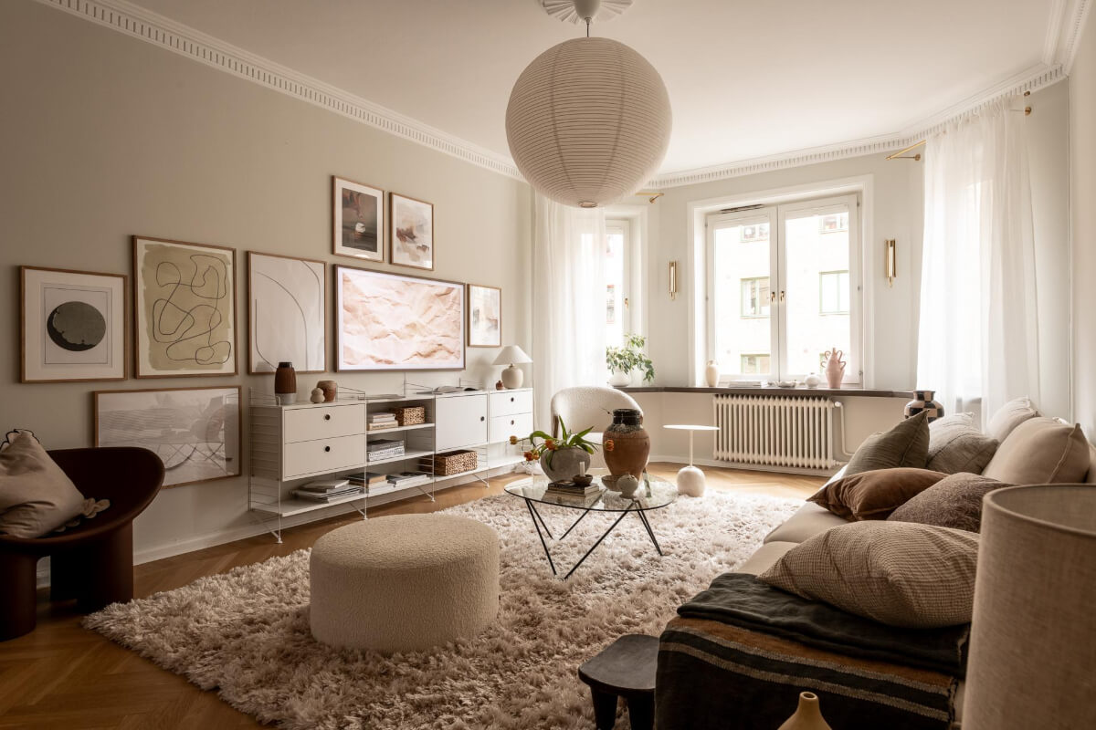 A Beautiful Calm 1920s Apartment in Gothenburg 5 living room with gallery wall