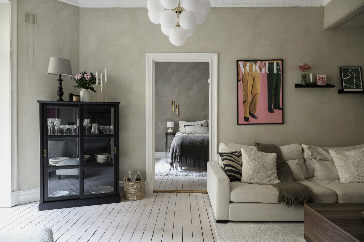 Limewash Wall and Period Features in a Swedish Apartment 2 living room wooden floor gray walls