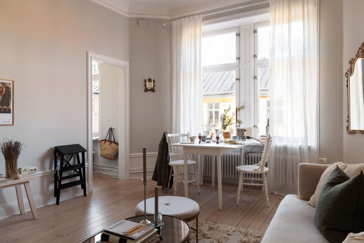 A Small Light Gray Apartment with Period Features 6 living room wooden floor light gray walls