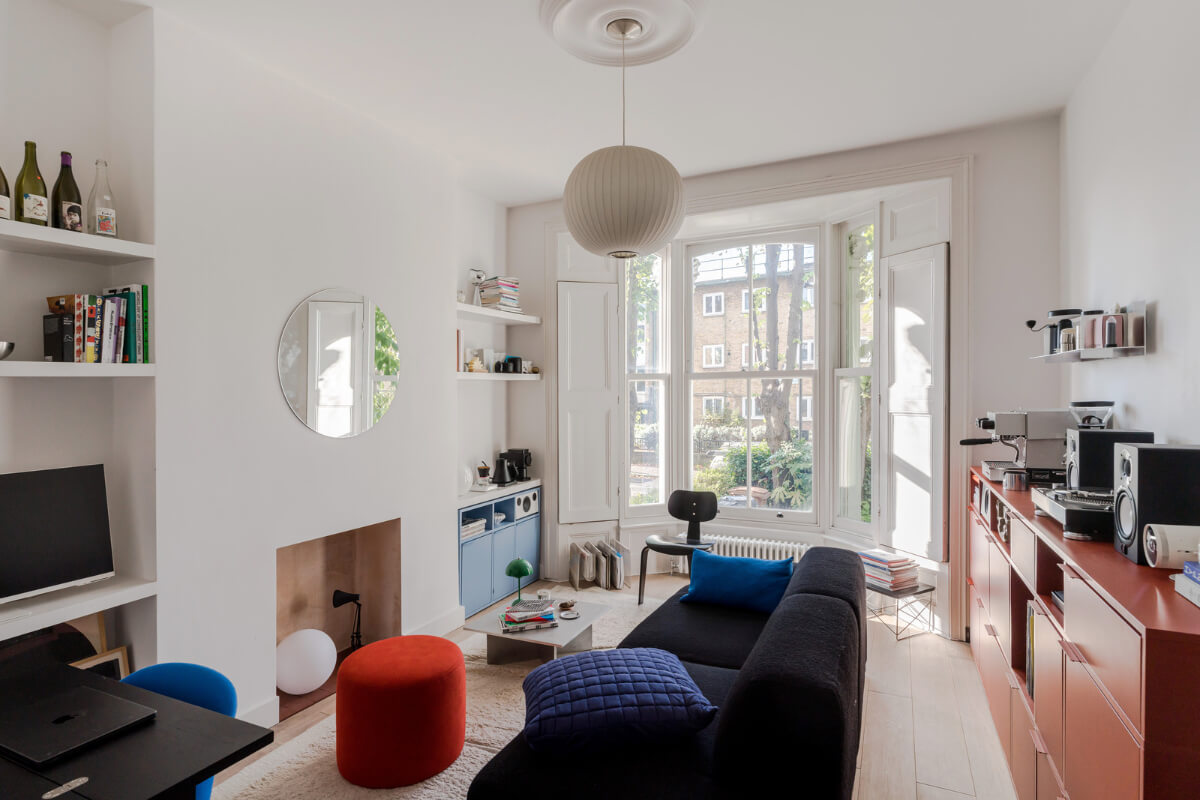 A Modern Apartment in a London Victorian House 2 living room wooden shutters bay windwo