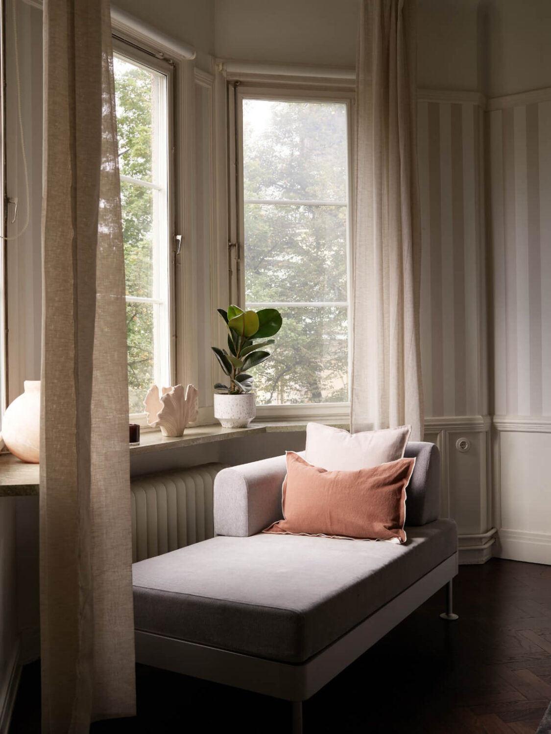 A Grand Early 20th-Century Apartment in Stockholm 22 lounge sofa bay window