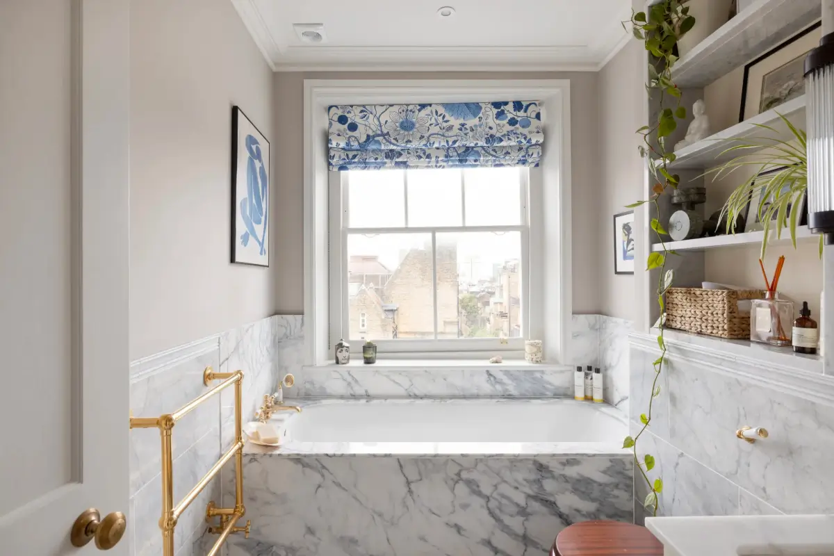 A Beautiful Duplex Apartment in a Notting Hill Townhouse 15 marble bathroom with shelves above toilet