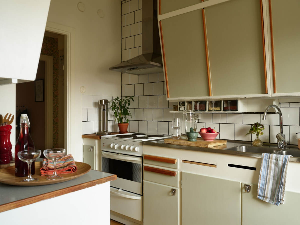 A Charming Midcentury Apartment with Original Features 11 midcentury kitchen white tiles