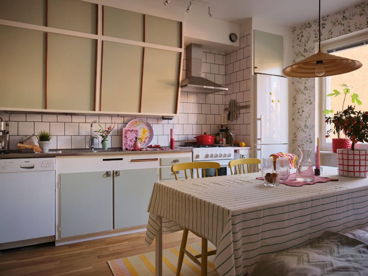 A Two-Bedroom Apartment with the Original Midcentury Kitchen 24 midcentury kitchen with sage green cupboards and large dining table