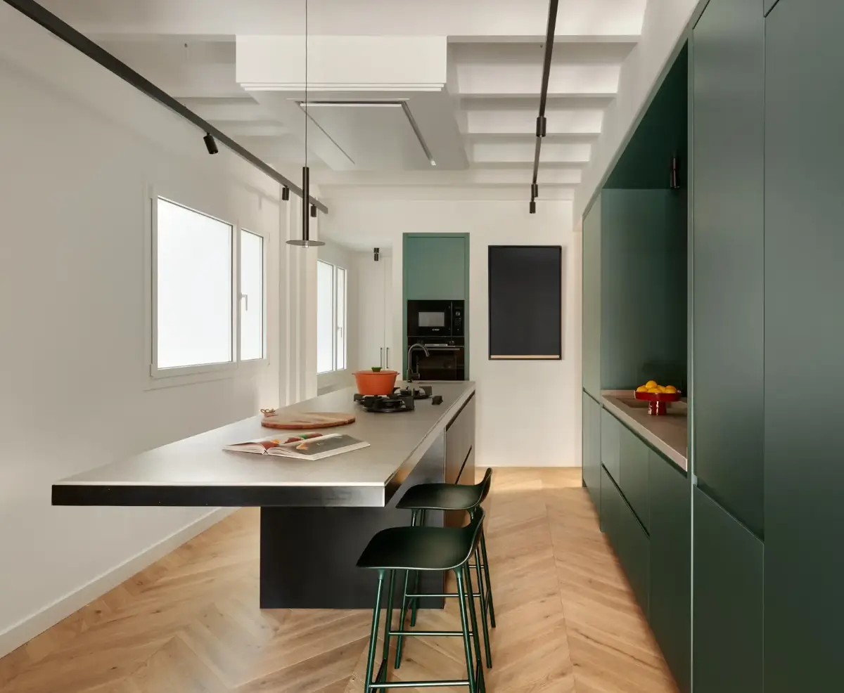 A Modern Barcelona Apartment with a Pink Bathroom 11 modern green kitchen with island