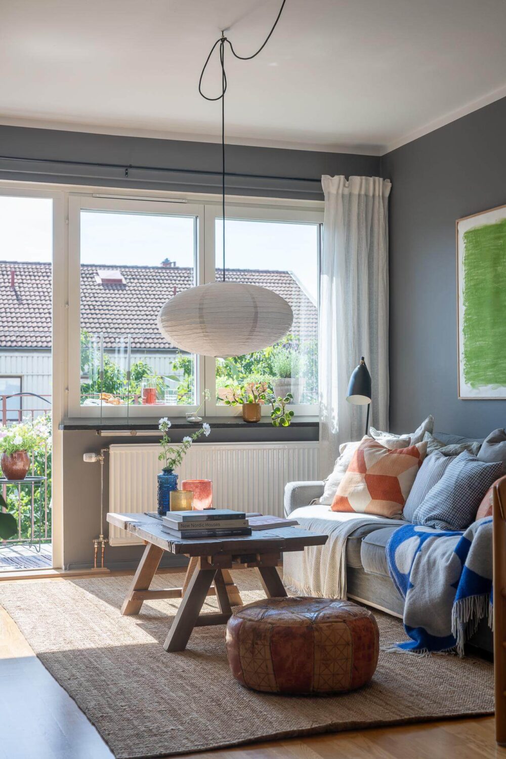 Light Rooms and a Moody Color Palette in a 1930s Apartment 3 moody gray living room wooden coffee table