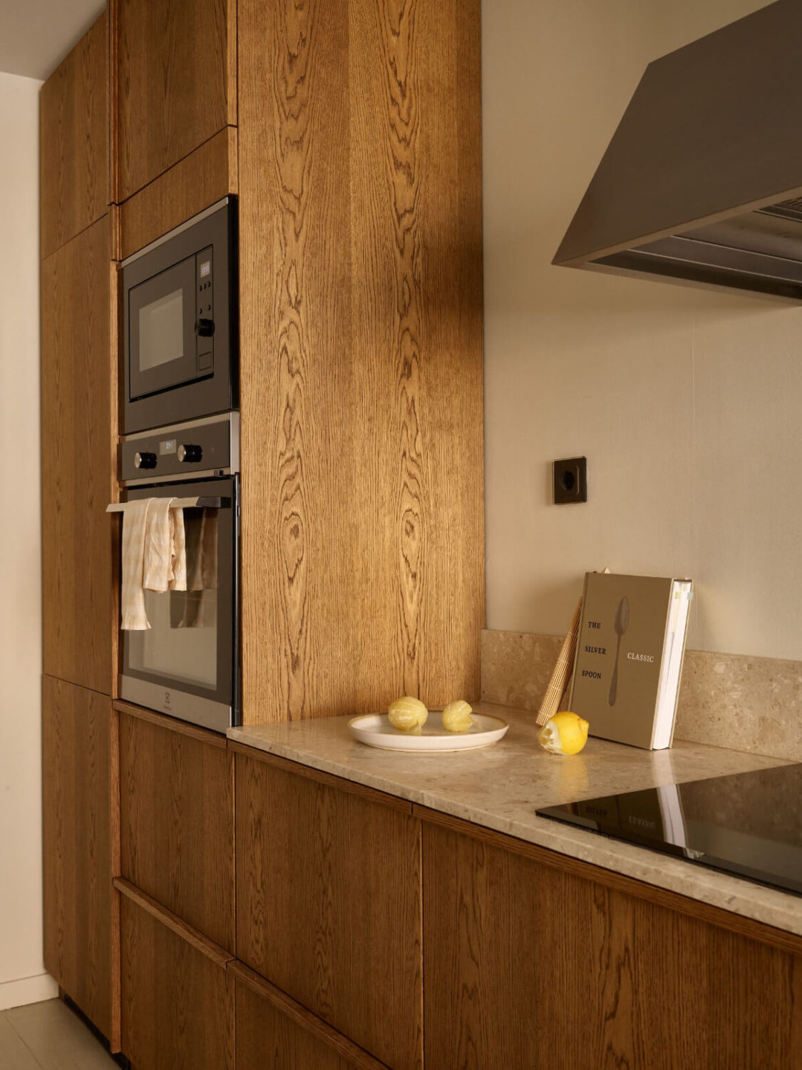 A Stockholm Apartment with a Beautifully Renovated Kitchen 14 oak kitchen floor to ceiling cabinets