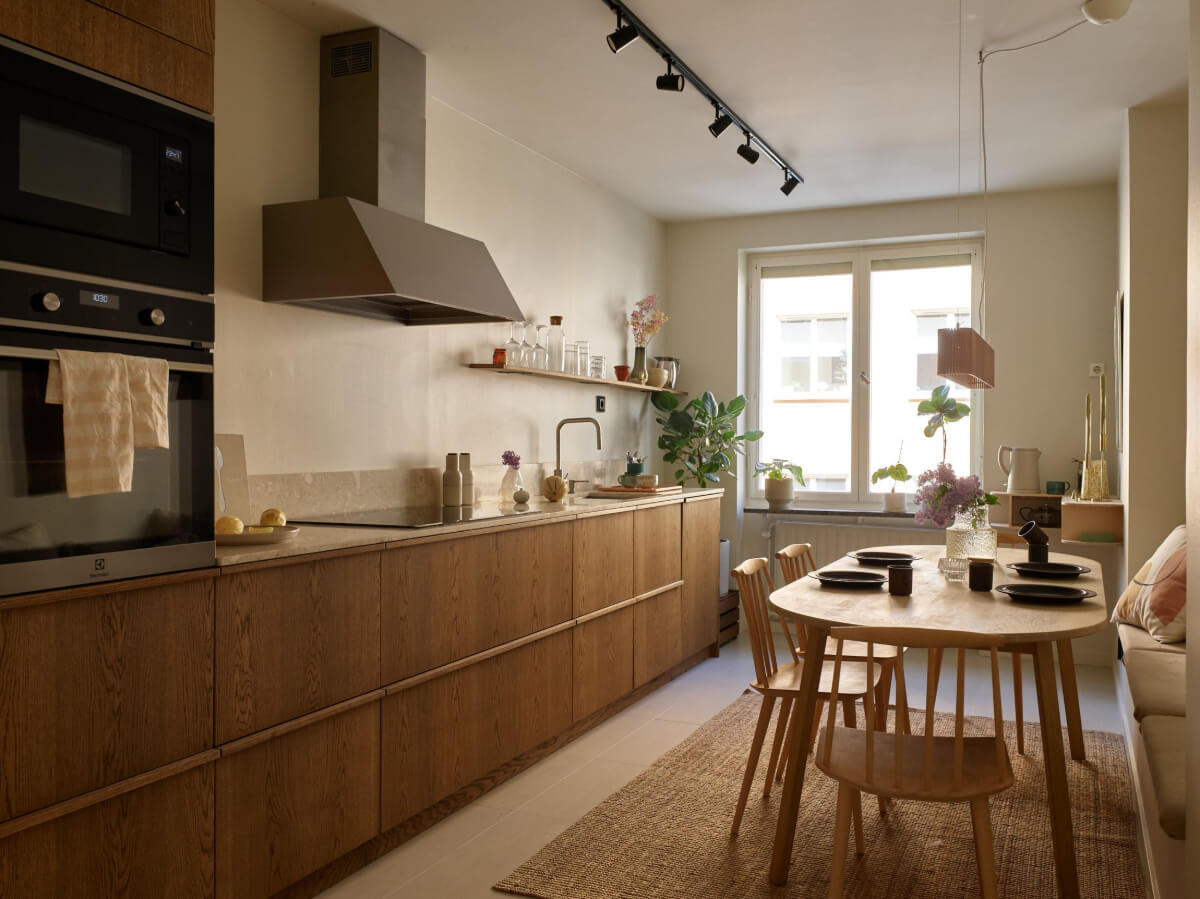 A Stockholm Apartment with a Beautifully Renovated Kitchen 9 oak kitchen with large dining table and seating bench