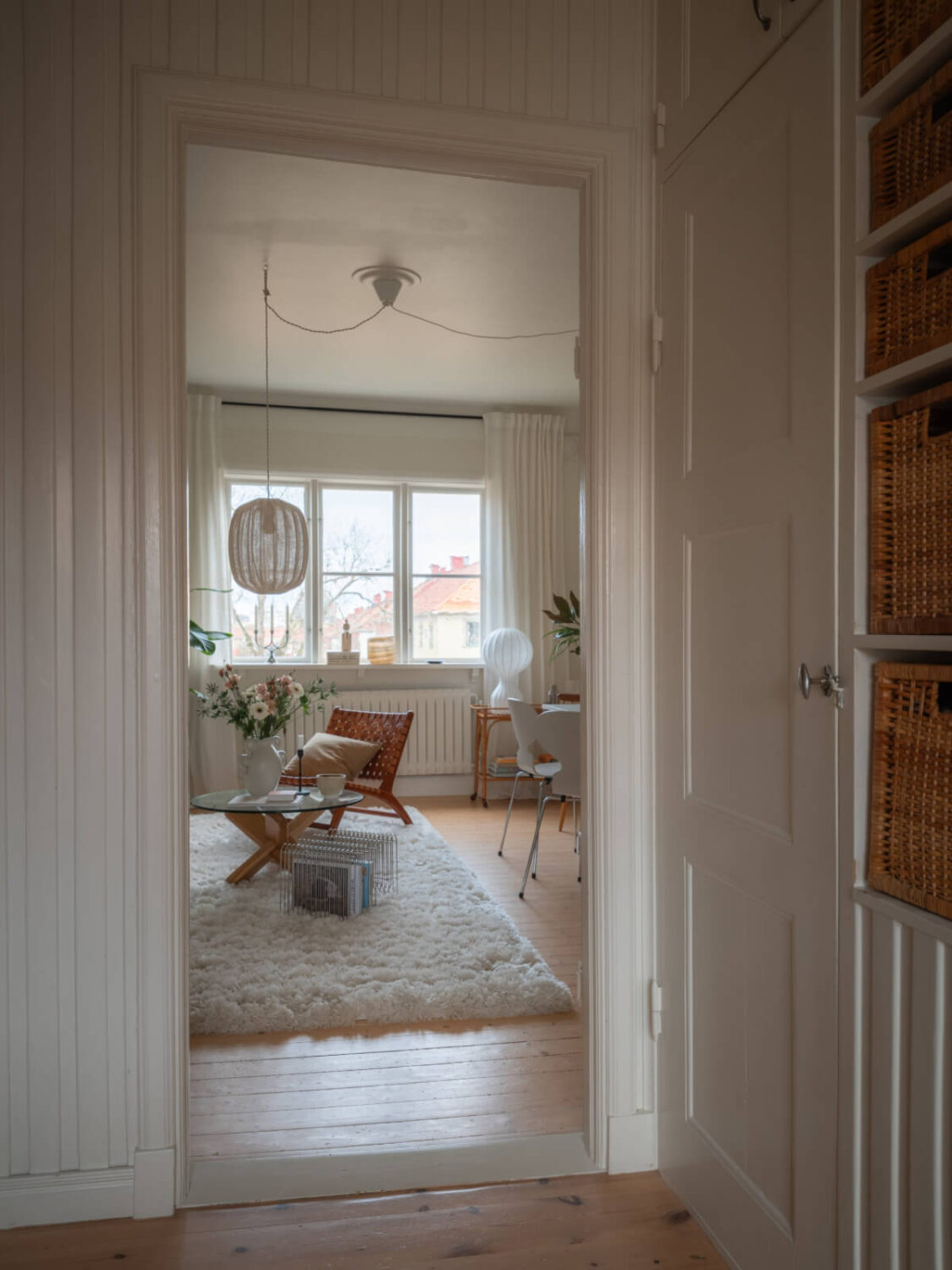 A Renovated Duplex Apartment with Exposed Brick Walls 13 open doorway to living room
