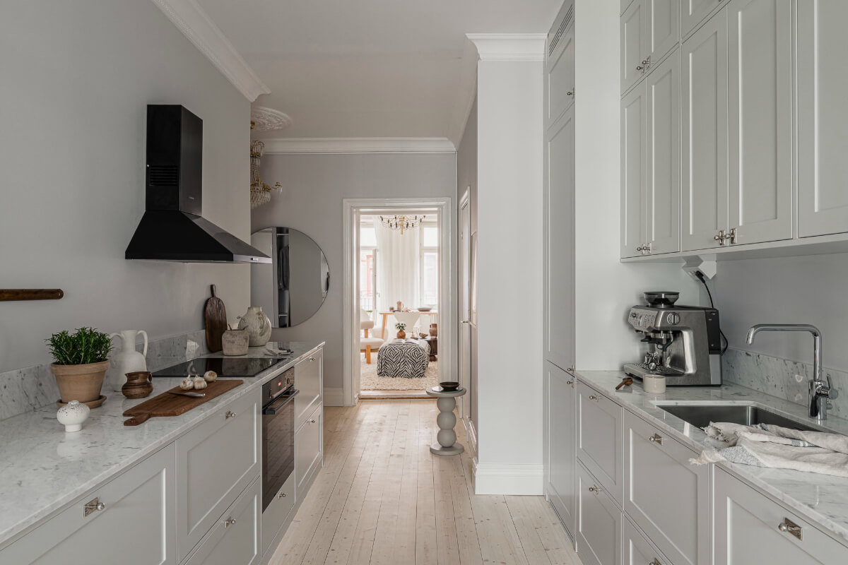 Period Features and Contemporary Solutions in Gothenburg 16 open floorplan light gray galley kitchen marble countertop