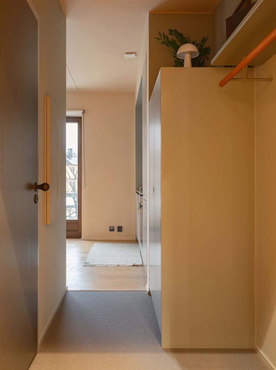A Small Modern Stockholm Apartment with Smart Storage Solutions 20 open hall coat rack