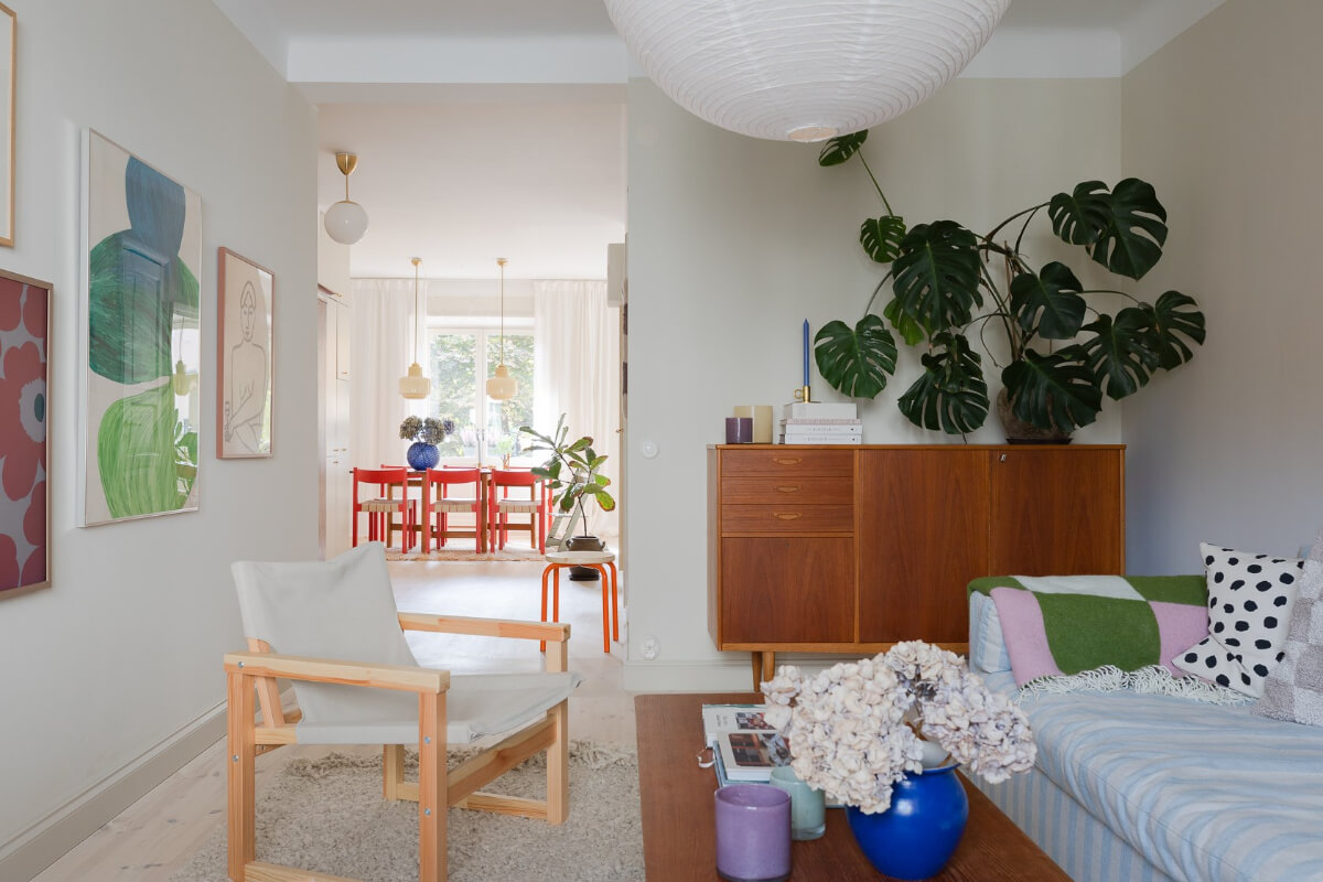 Modern Interiors in a Bright 1930s Apartment in Sweden 20 open living room midcentury cabienet