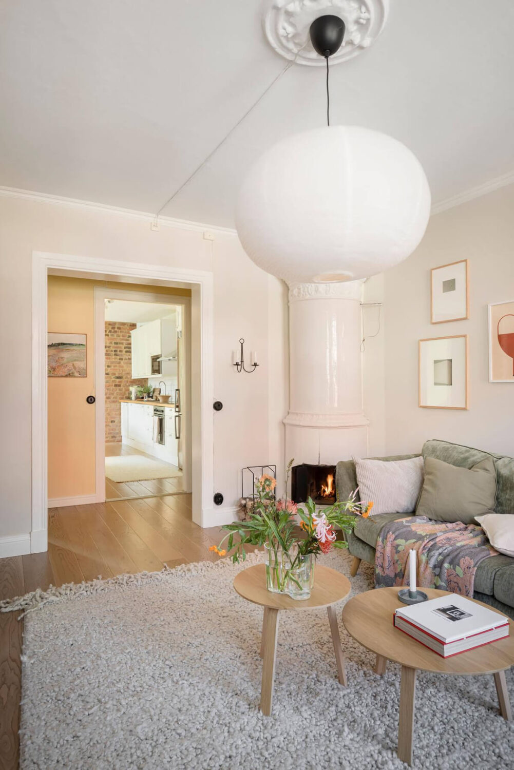 Bright Rooms with Light Color Tones in a Swedish Apartment 7 open living room round fireplace