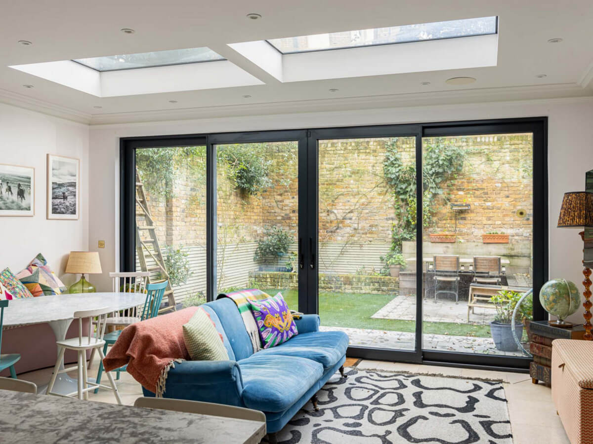 An Extended Family Home in London with Pink Crittall Doors 6 open plan kitchen sitting area