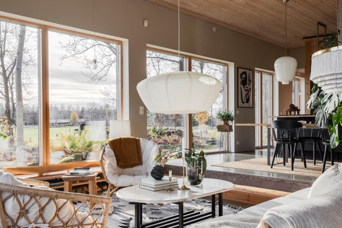 A Swedish Architectural Villa Surrounded by Nature 4 open plan living room kitchen large windows