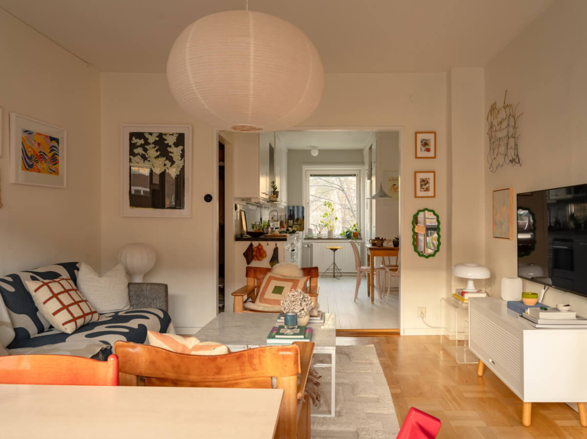 A Charming Midcentury Apartment with a Reading Room 6 open plan living room kitchen with parquet floor