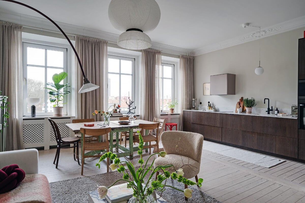 Period Features and Modern Materials in a Swedish Apartment 7 open plan living space large windows wooden floor