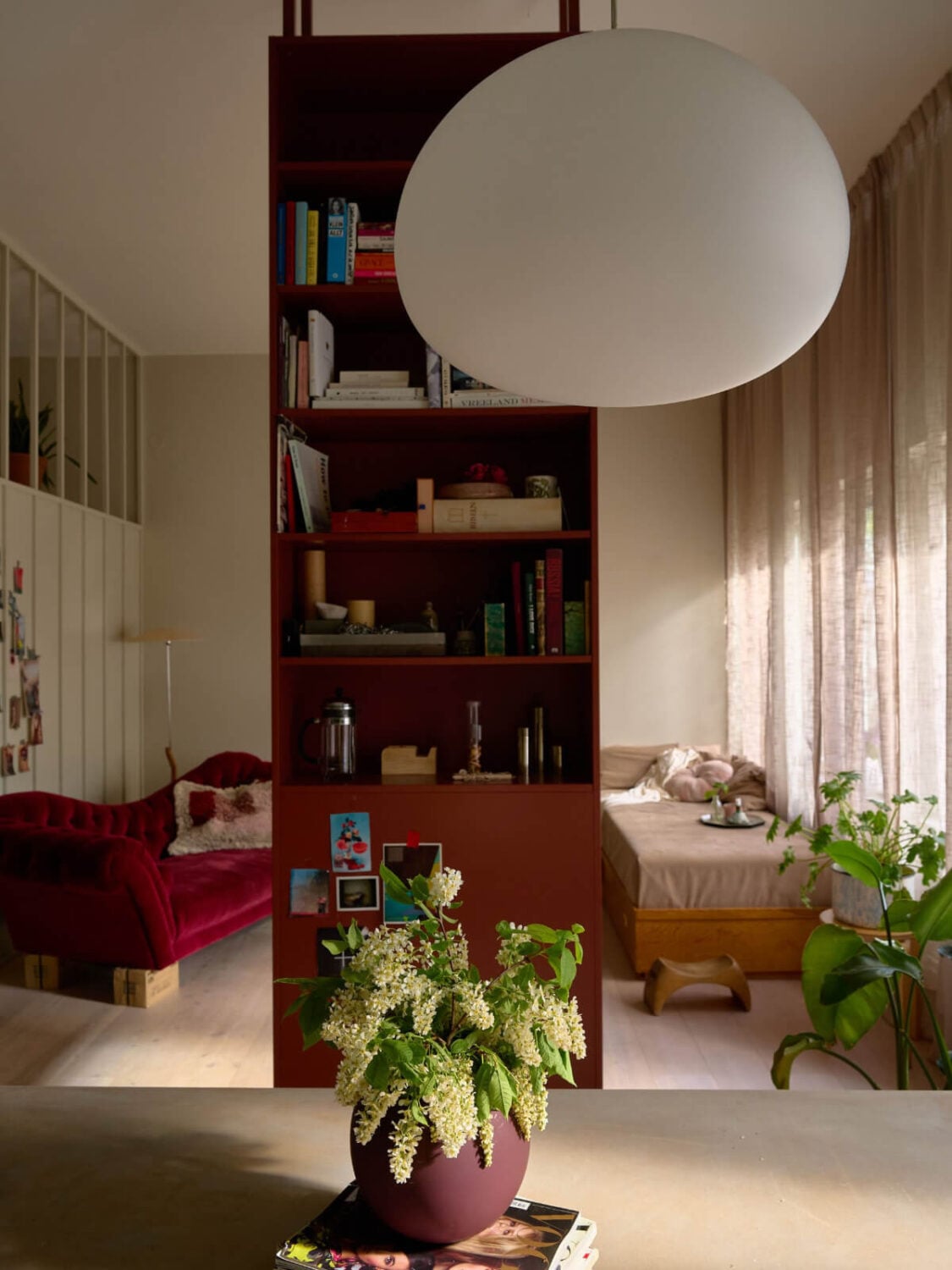 High Ceilings in a Small Swedish Loft Designed for a Family 7 open plan living space red cabinet room divider
