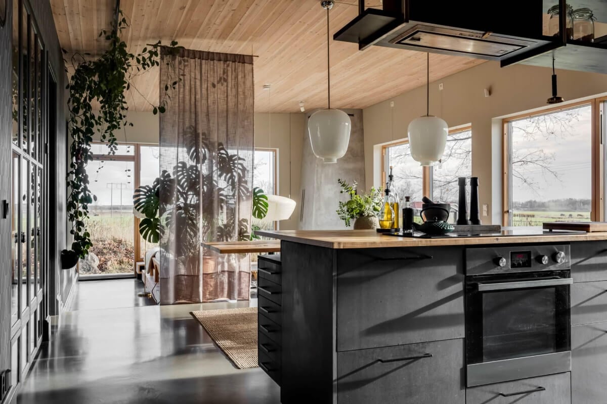 A Swedish Architectural Villa Surrounded by Nature 8 open plan living space with room divider curtain