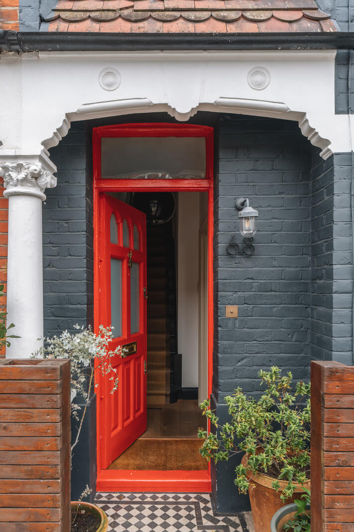 A Charming Light Edwardian House with a Tiny Garden 23 orange-red front door