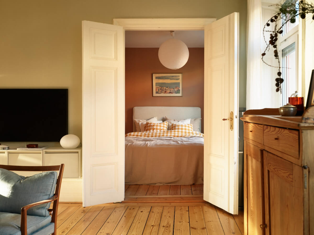 A Charming Historic Stockholm Apartment with a Blue Kitchen 21 original wooden doors to bedroom