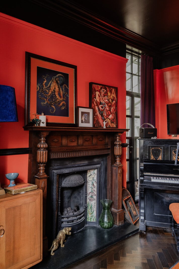 A Grand Victorian Villa in Manchester with Bold Interiors 3 ornate fireplace red and black sitting room victorian villa nordroom