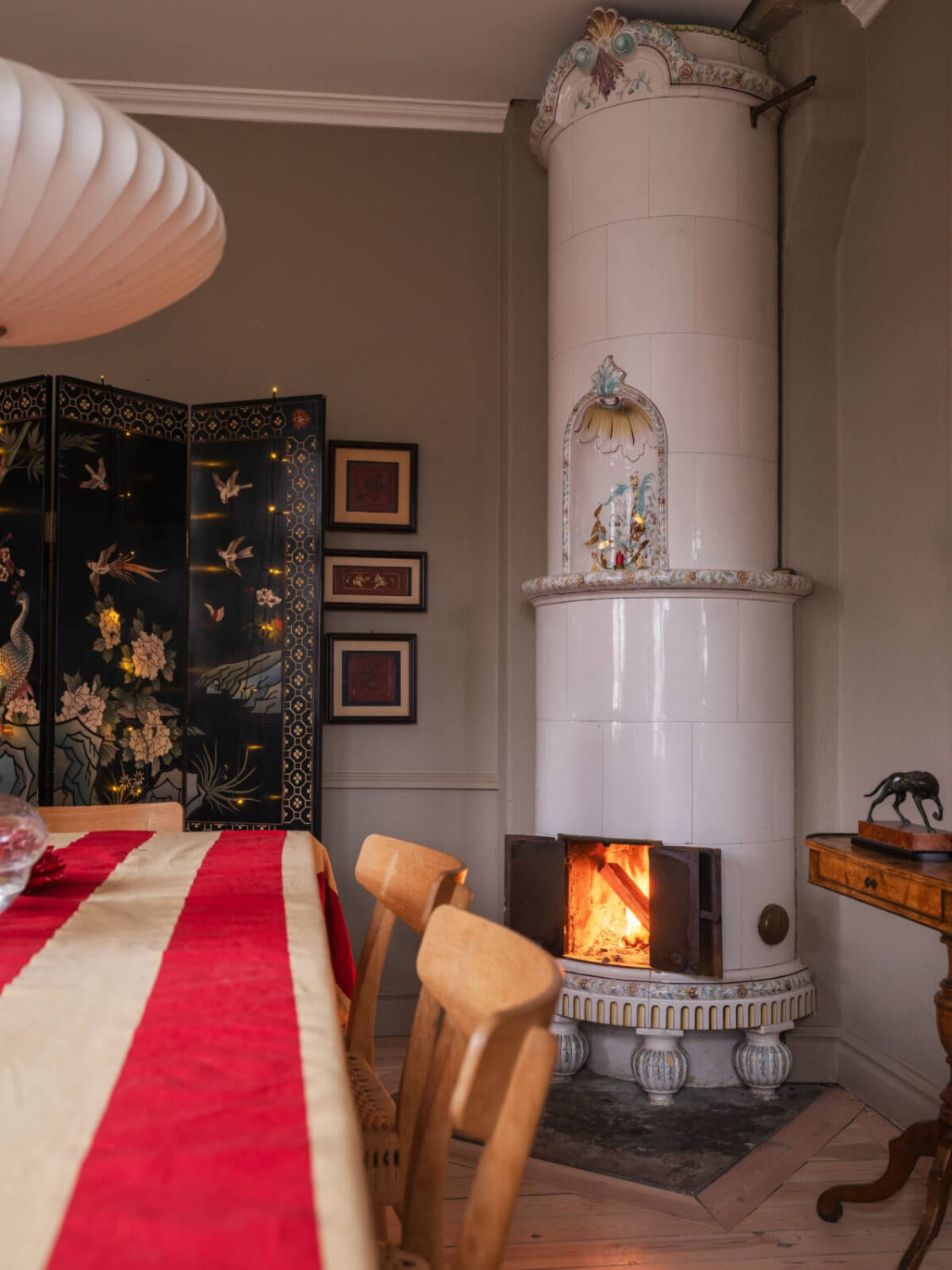 A Beautiful Turn-of-the-Century Family Home in Sweden 13 painted tiled fireplace