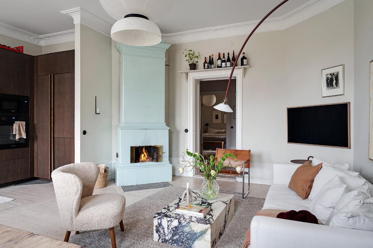 Period Features and Modern Materials in a Swedish Apartment 6 pale blue fireplace living room