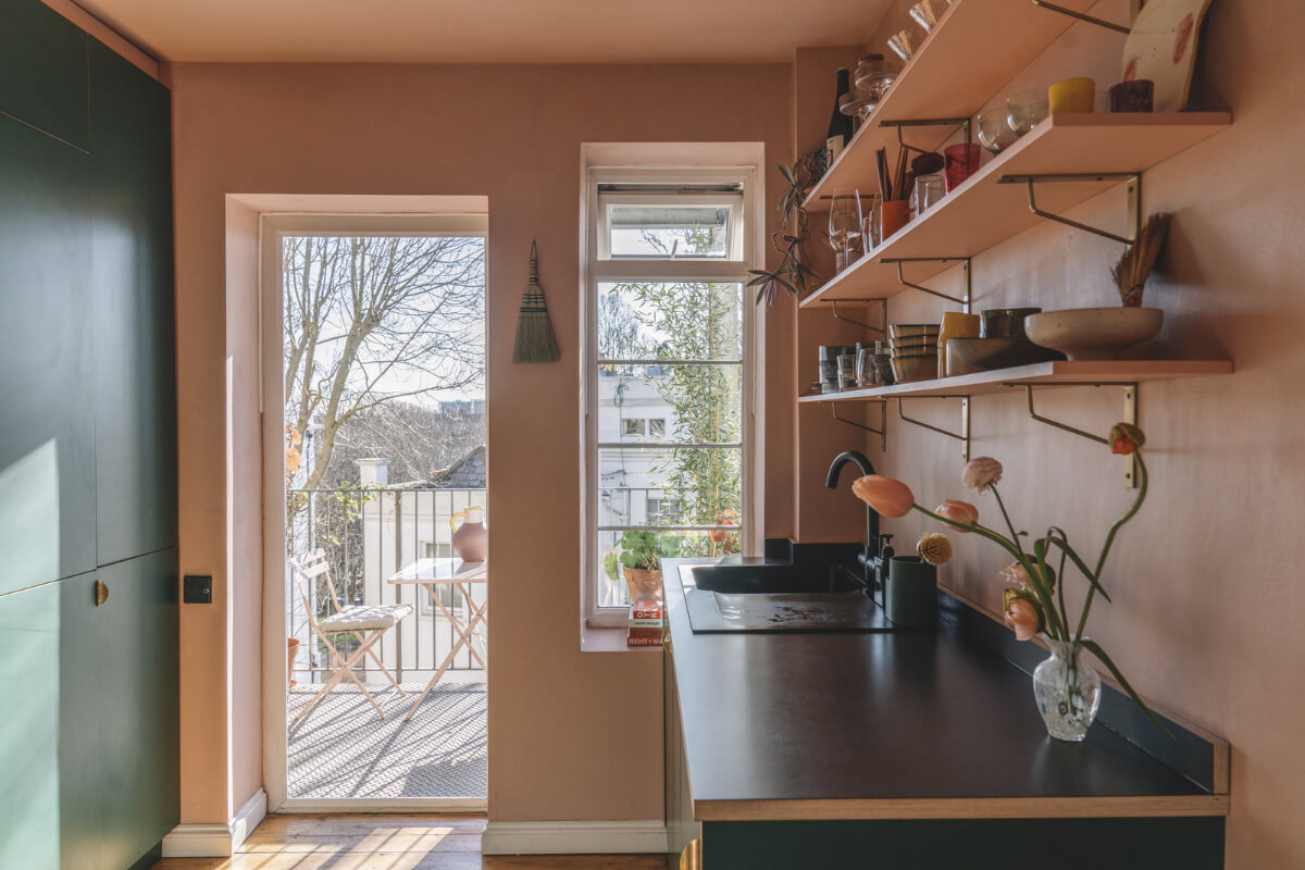 A London Apartment with a Pink and Green Kitchen 6 pink and green kitchen with shelves