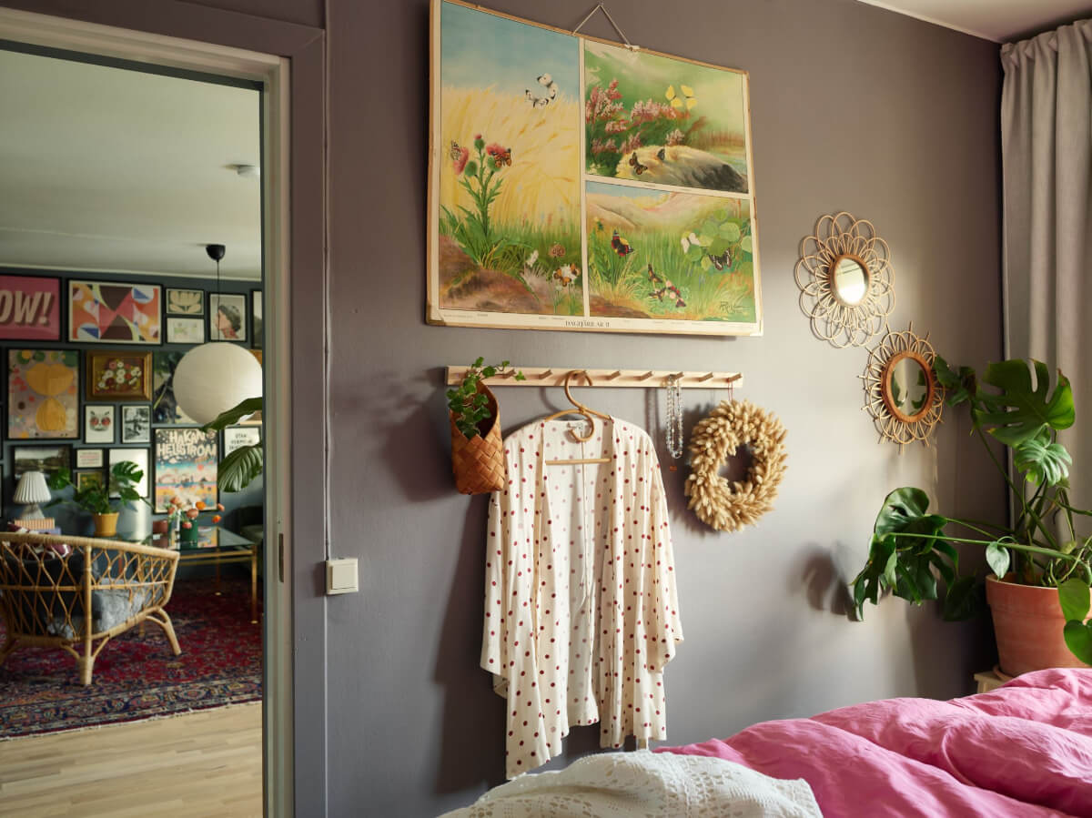 A Colorful Midcentury Apartment Filled with Art and Plants 19 plum colored bedroom wall hooks