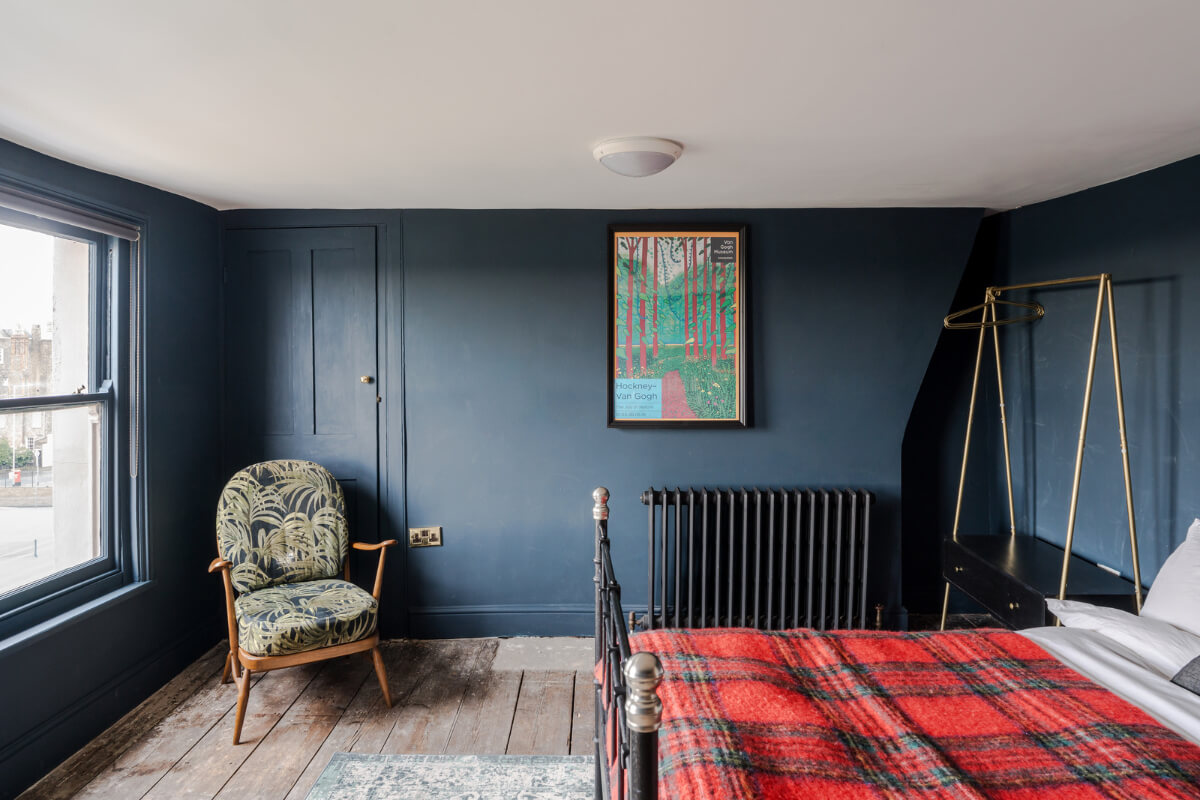 Timeworn Original Floorboards in a Regency Seaside Home 17 raw wooden floorboards dark blue bedroom