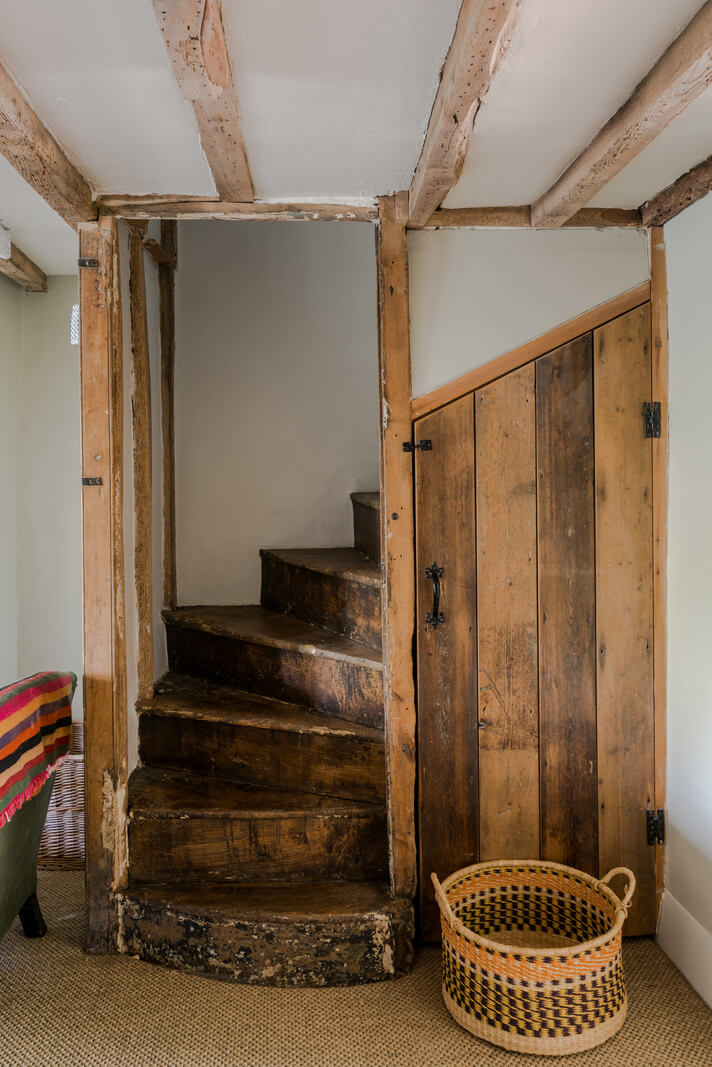 A Carefully Selected Color Palette in an 18th-Century English Cottage 12 raw wooden staircase