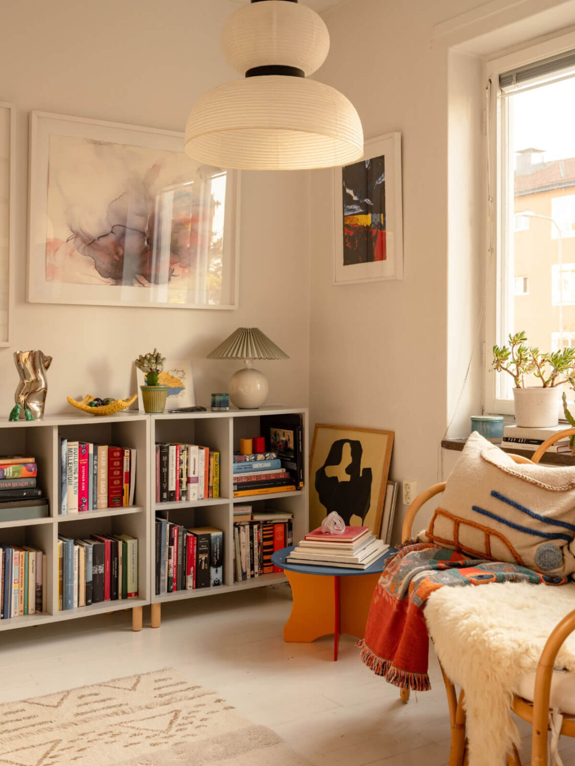 A Charming Midcentury Apartment with a Reading Room 19 reading room with ikea eket cabinets