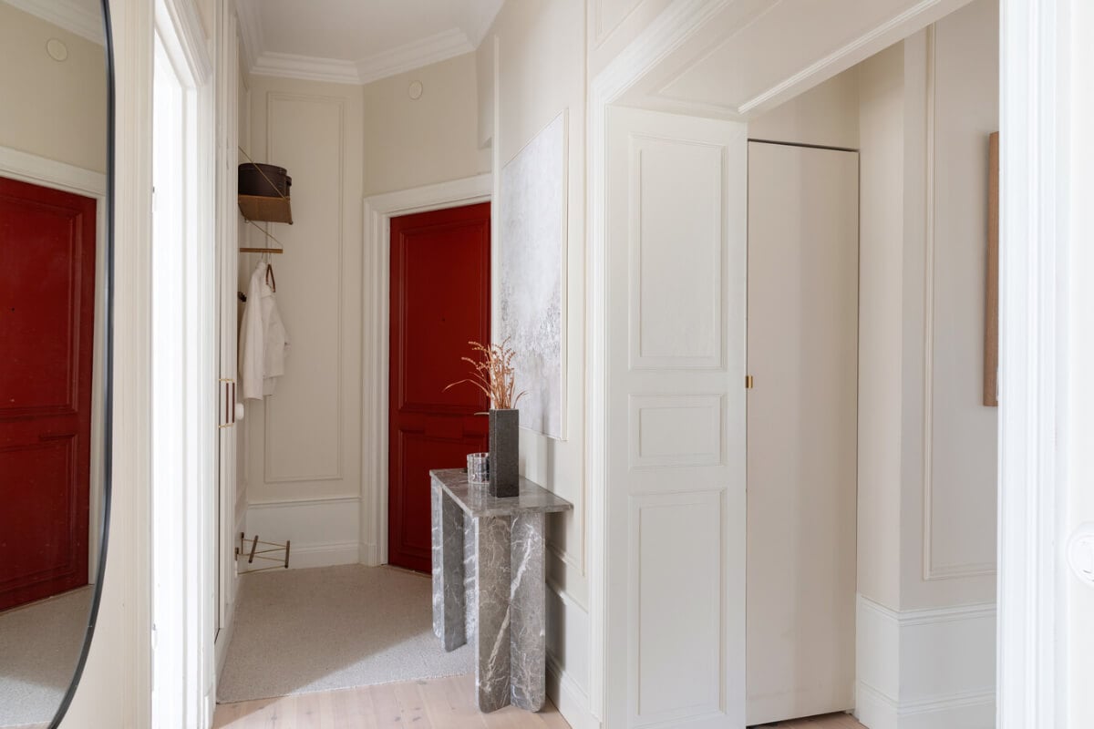 A Calm, Neutral Color Palette in a Classic Swedish Apartment 29 red front door entry A Calm, Neutral Color Palette in a Classic Swedish Apartment